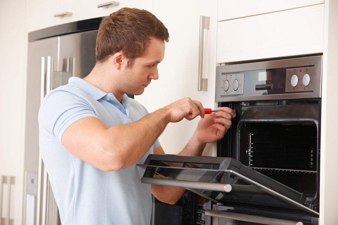 Picture of an oven repair. This photo was purchased from Adobe Stock. 
